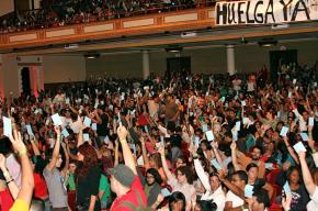 UPR students vote at a mass general assembly to continue their strike